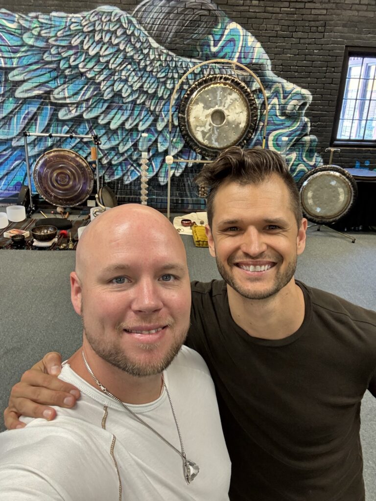 Sean Owen and Alex Ballew in front of the gongs