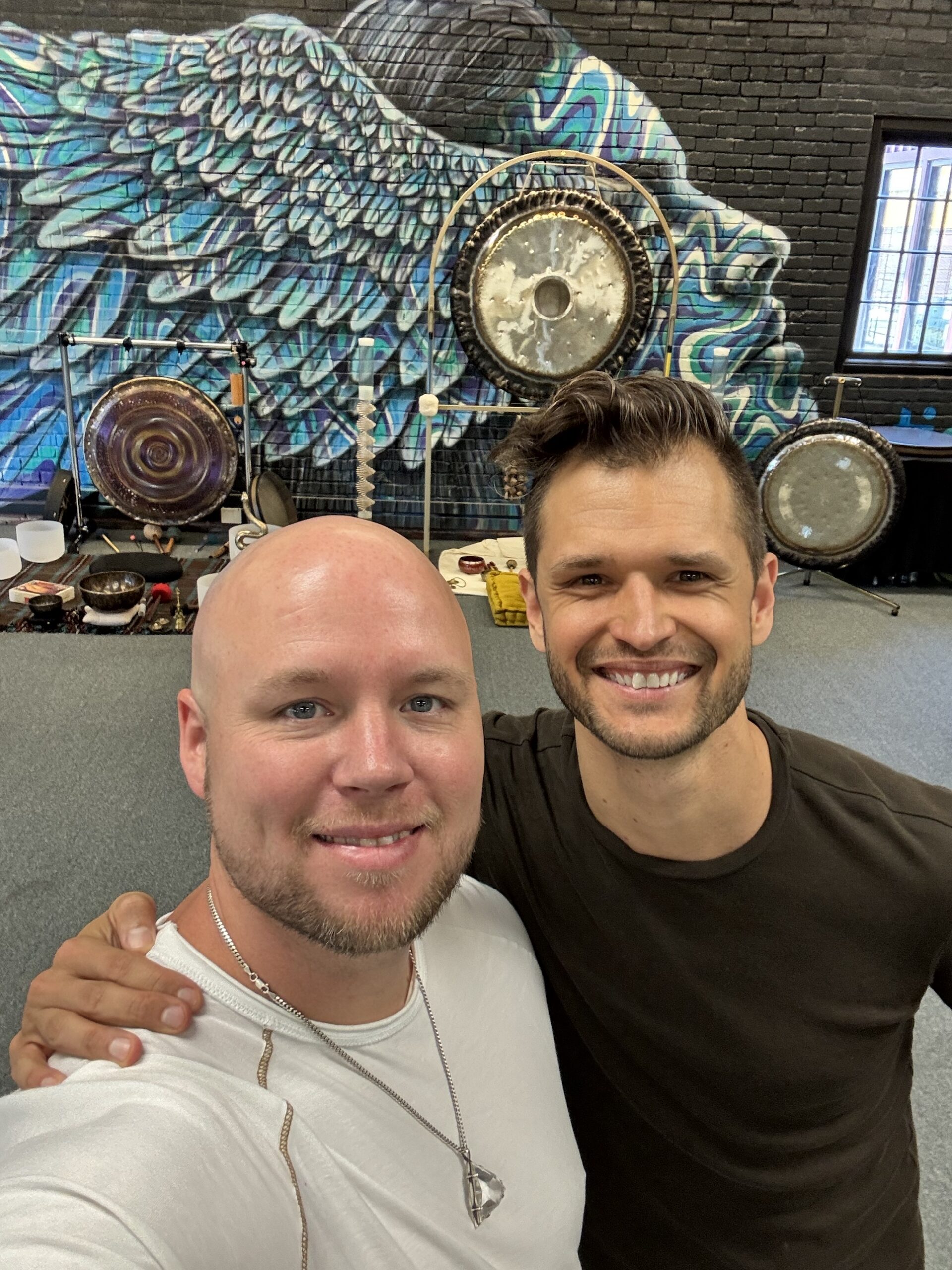 Sean Owen and Alex Ballew in front of the gongs